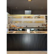 Detail of counter and interiors of Opera bakery shop, designed and delivered by Devoto Design