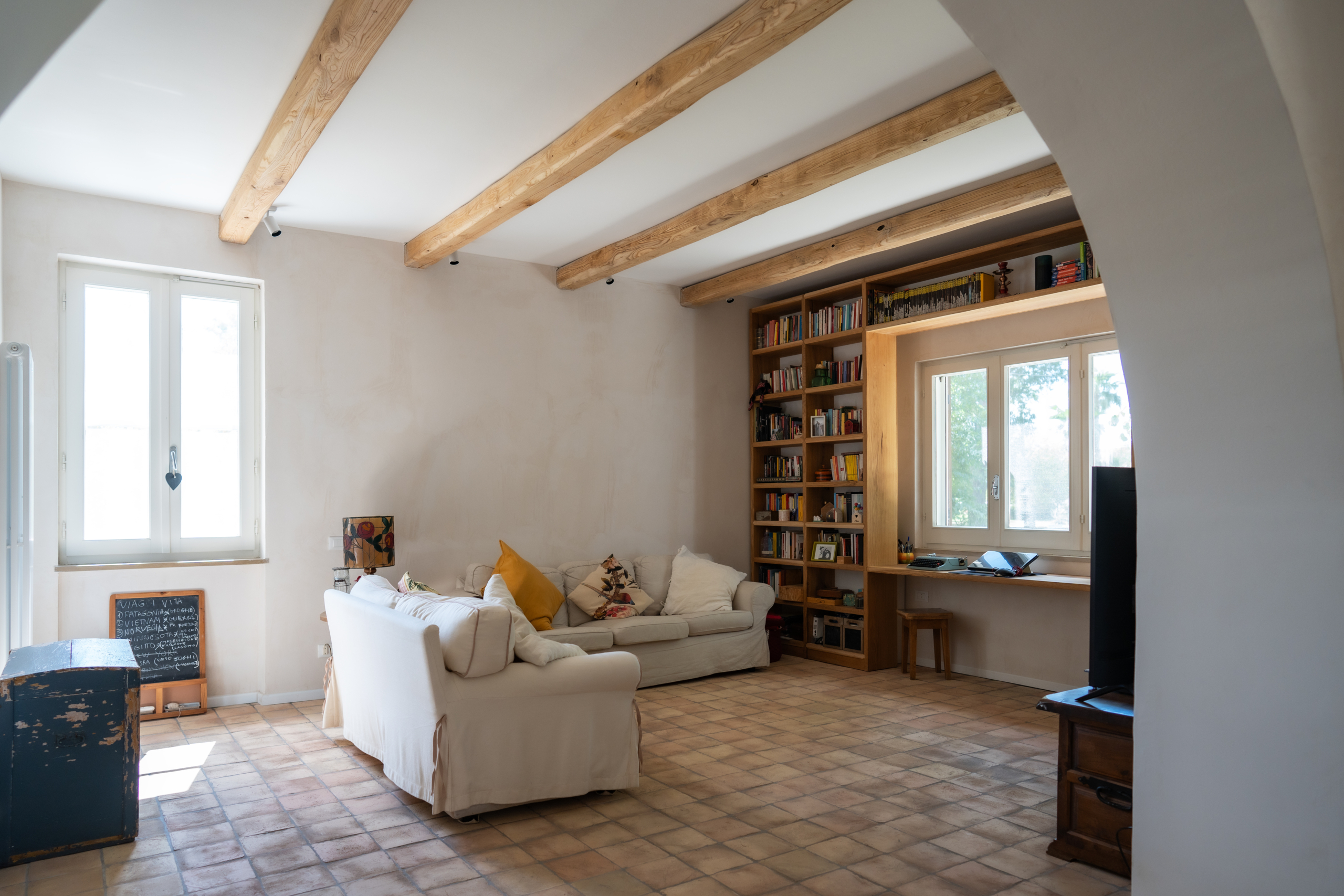 living room with window and bookcase