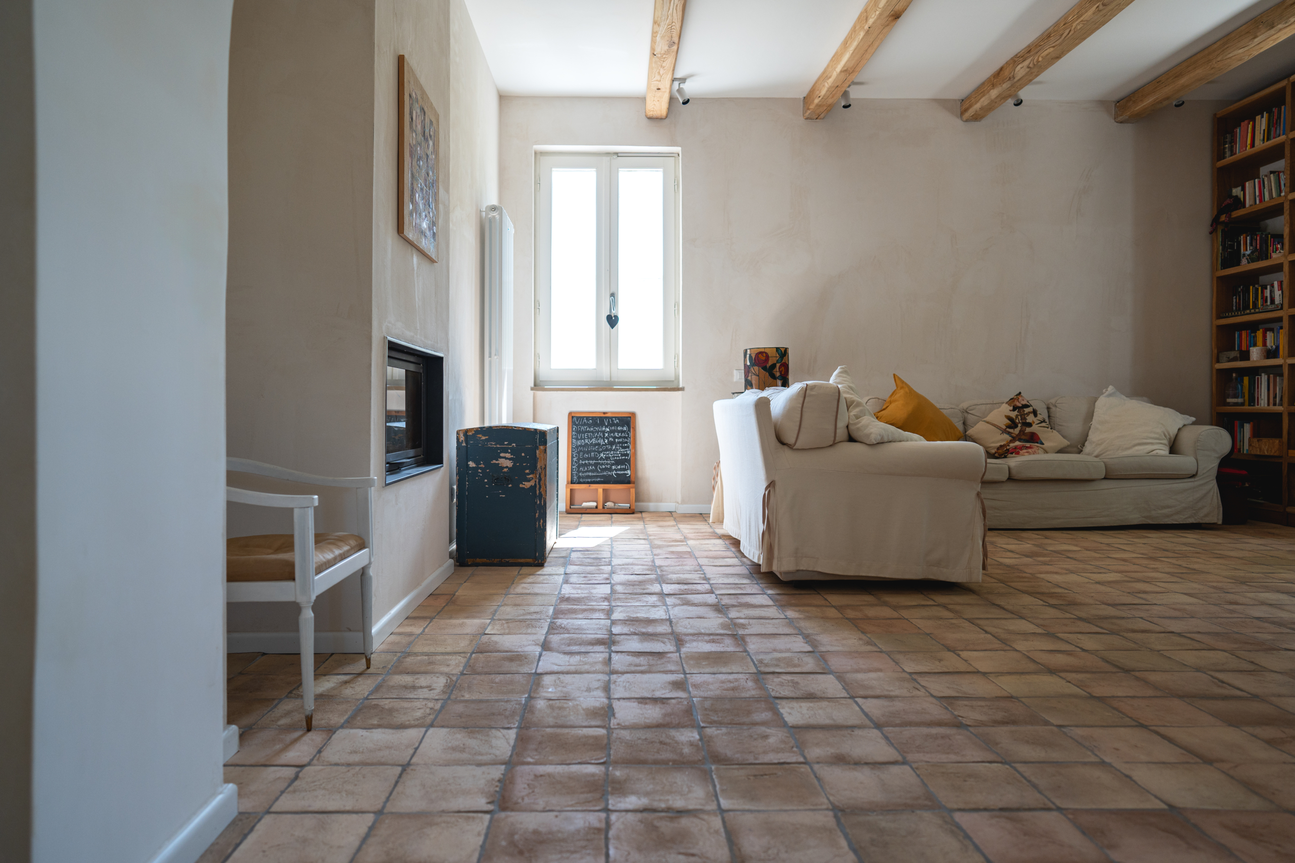 living room with window and sofas